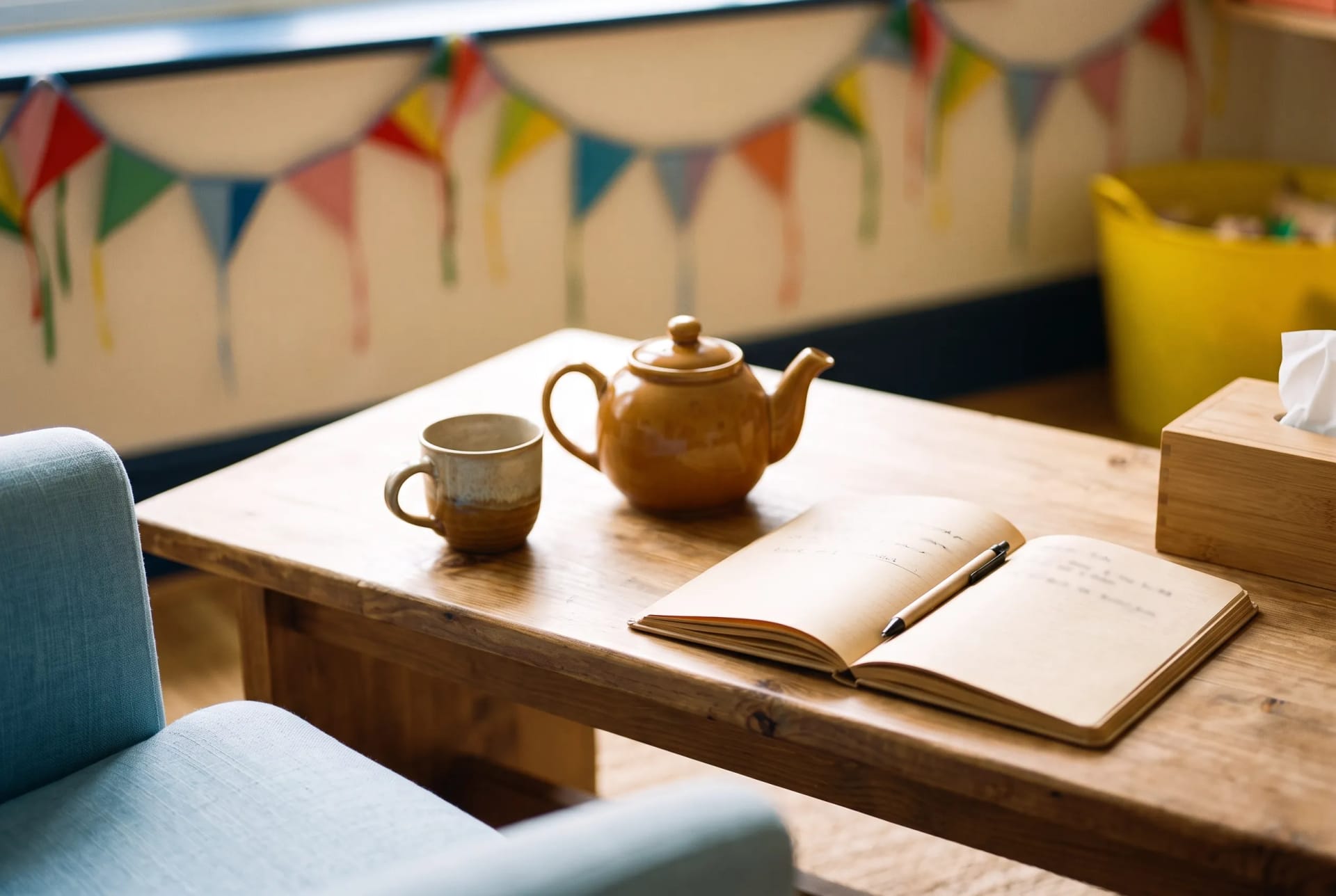 A pot of tea and an open notebook ready for a parent consultation at Little Kite Therapy in Cardiff